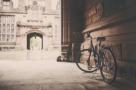 Bicycle parked near wall