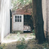 old garage with a vintage car